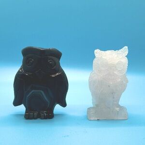 2 stone owls, blue and pink